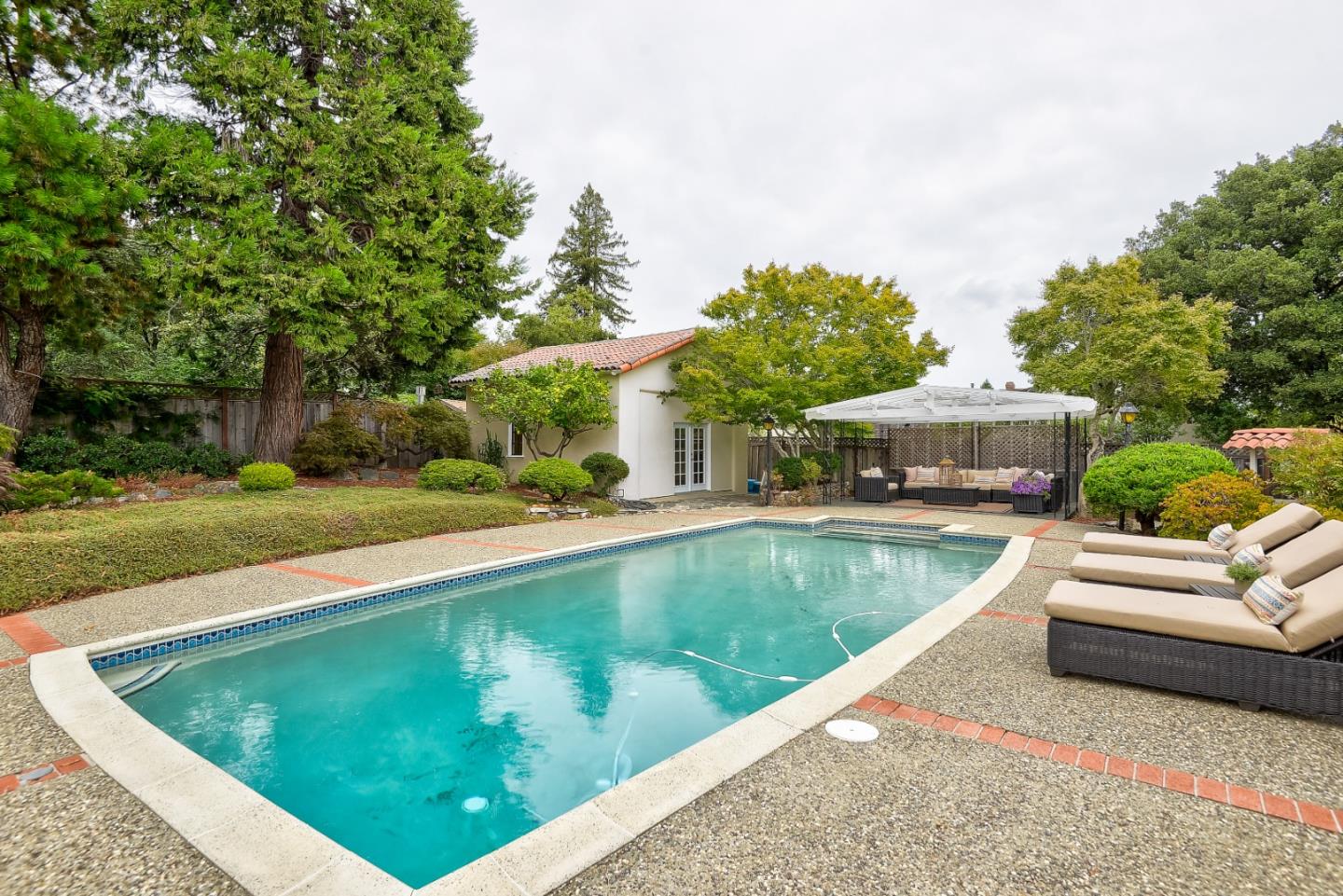 125 Alturas Drive Burlingame, CA 94010 - Photo 53 of 59 a view of a swimming pool with a patio