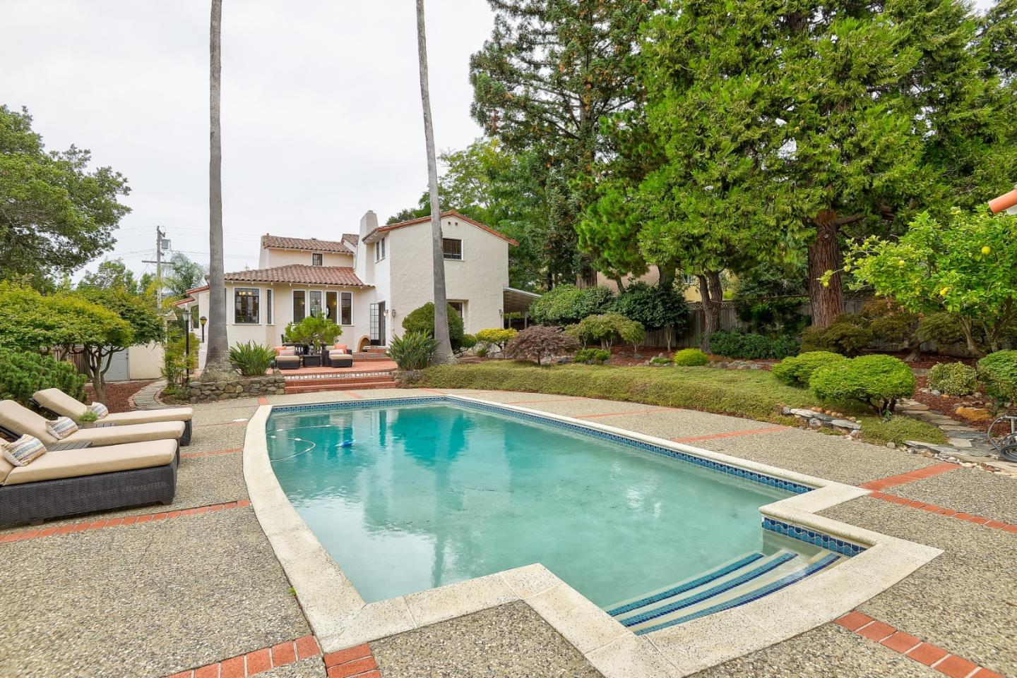 125 Alturas Drive Burlingame, CA 94010 - Photo 56 of 59 a view of a swimming pool with a patio