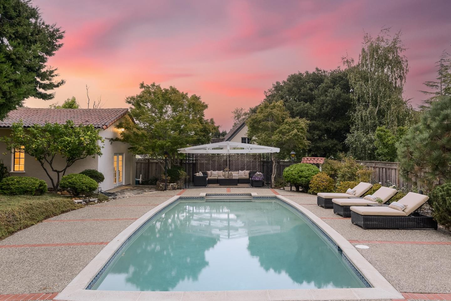 125 Alturas Drive Burlingame, CA 94010 - Photo 8 of 59 a view of a patio with couches and a table and chairs with wooden fence