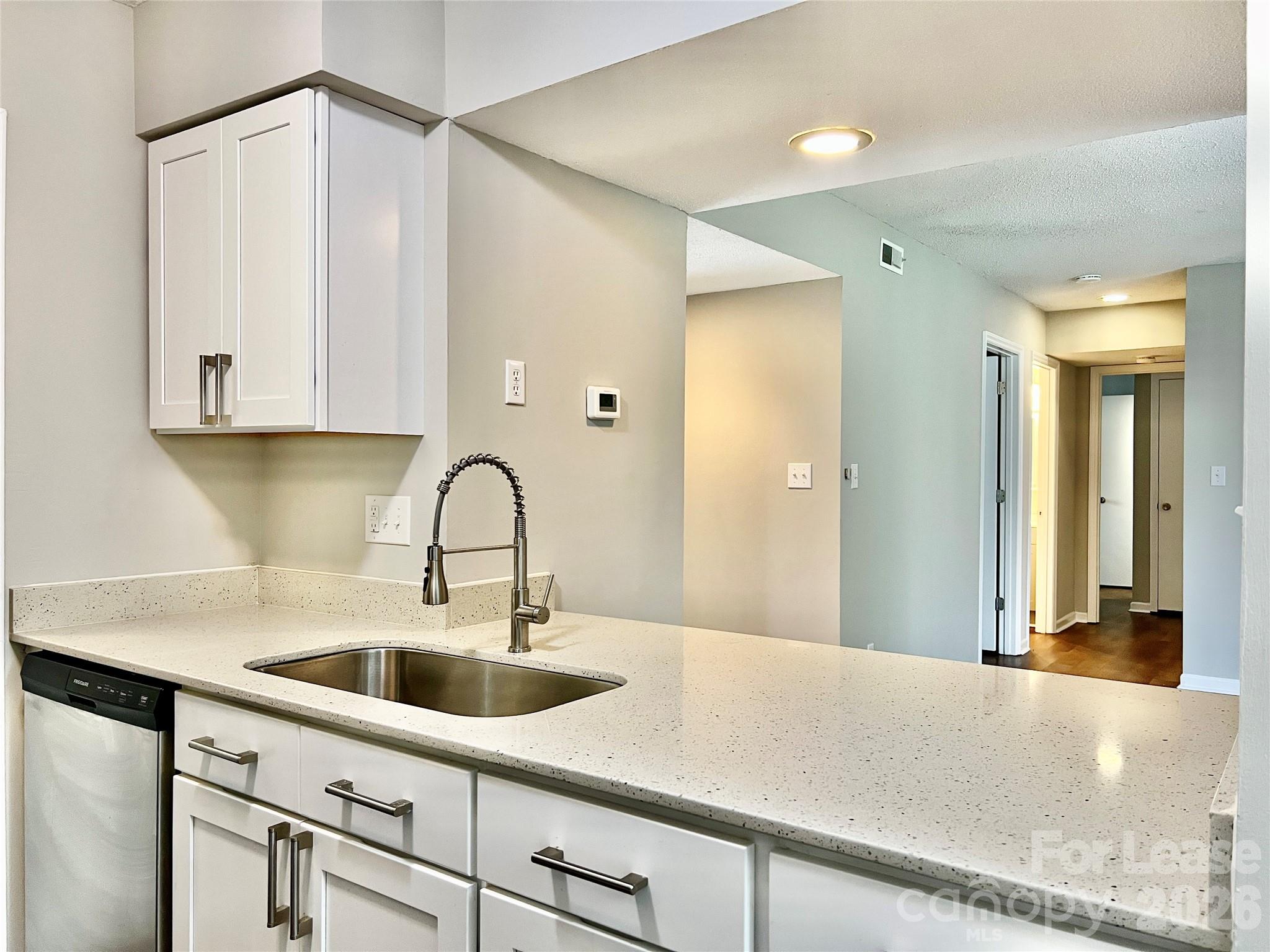 11084 Harrowfield Road Charlotte, NC 28226 - Photo 12 of 31 a kitchen with a sink and cabinets