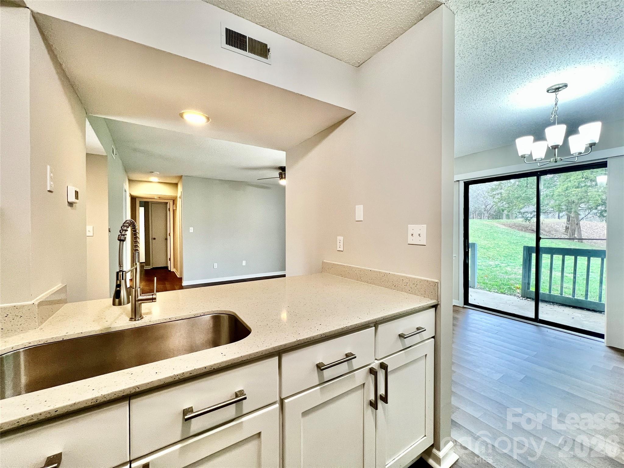 11084 Harrowfield Road Charlotte, NC 28226 - Photo 14 of 31 a kitchen with a sink and large window