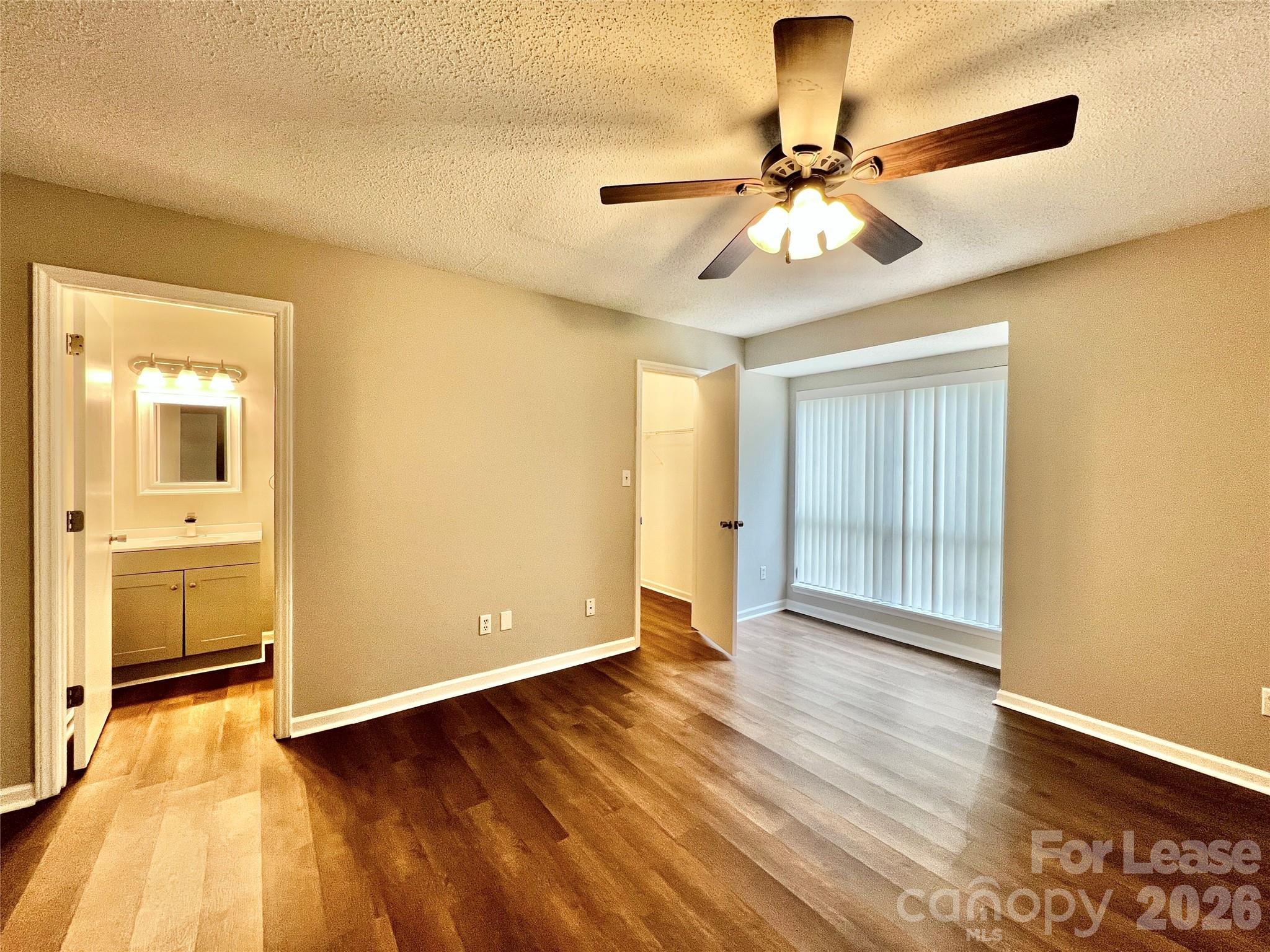 11084 Harrowfield Road Charlotte, NC 28226 - Photo 17 of 31 a view of an empty room with wooden floor