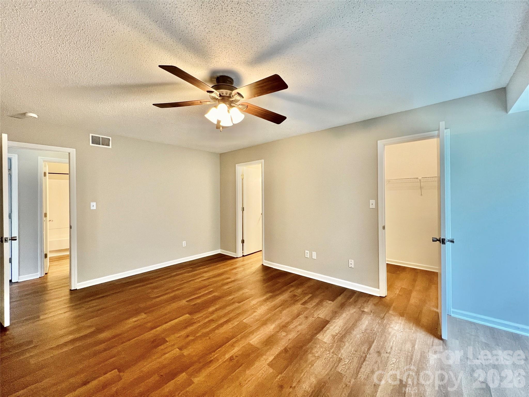 11084 Harrowfield Road Charlotte, NC 28226 - Photo 19 of 31 a view of an empty room with wooden floor