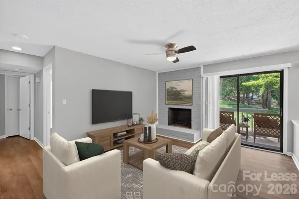 a living room with furniture and a flat screen tv