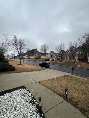a street view with couple of cars parked on road