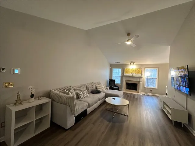 a view of a livingroom with furniture and window
