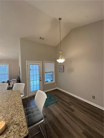 a kitchen with a sink white cabinets and white appliances