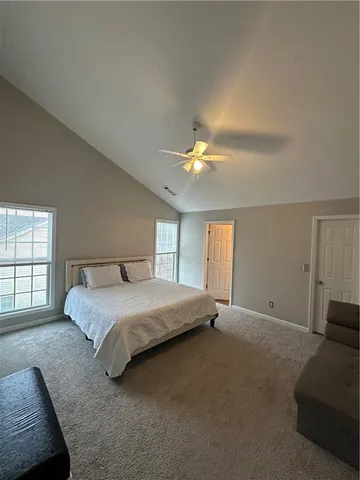 a bath tub sitting in a bathroom next to a window