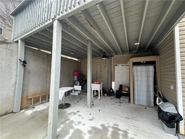 a view of a room with wooden floor and furniture