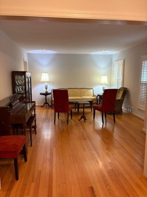 1777 Rosalind Drive Northeast Atlanta, GA 30329 - Photo 14 of 29 a living room with furniture and a wooden floor