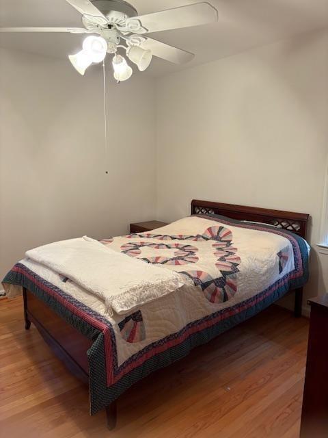 1777 Rosalind Drive Northeast Atlanta, GA 30329 - Photo 20 of 29 a bedroom with a bed and a chandelier