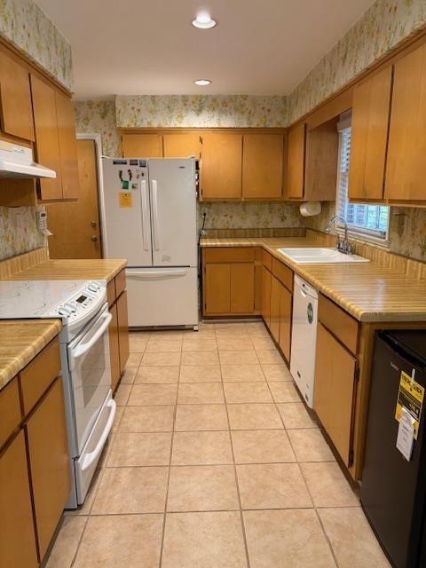 1777 Rosalind Drive Northeast Atlanta, GA 30329 - Photo 4 of 29 a kitchen with a stove top oven sink and cabinets