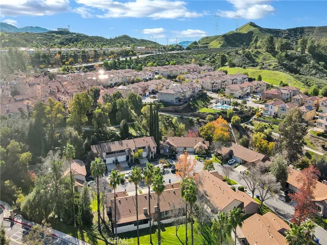 a aerial view of a residential apartment building with a yard