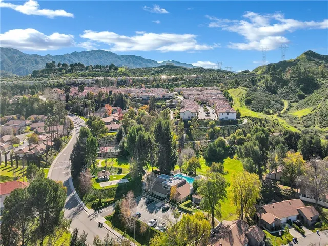 an aerial view of houses with yard