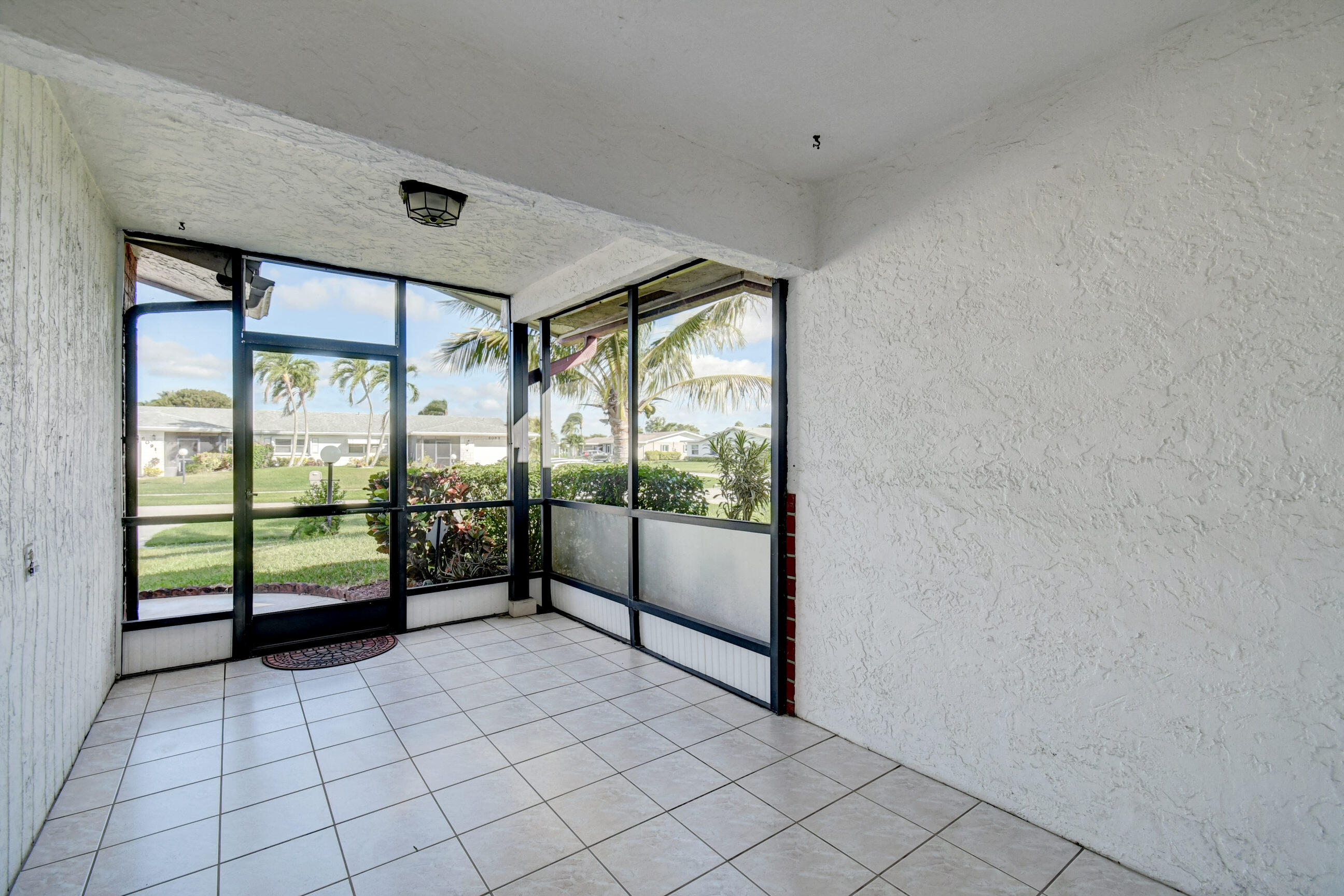 6088 Dusenburg Road Delray Beach, FL 33484 - Photo 4 of 40 Front Screened-In Porch