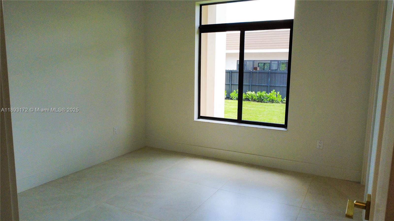 17354 Southwest 287th Street Homestead, FL 33030 - Photo 11 of 22 an empty room with a window