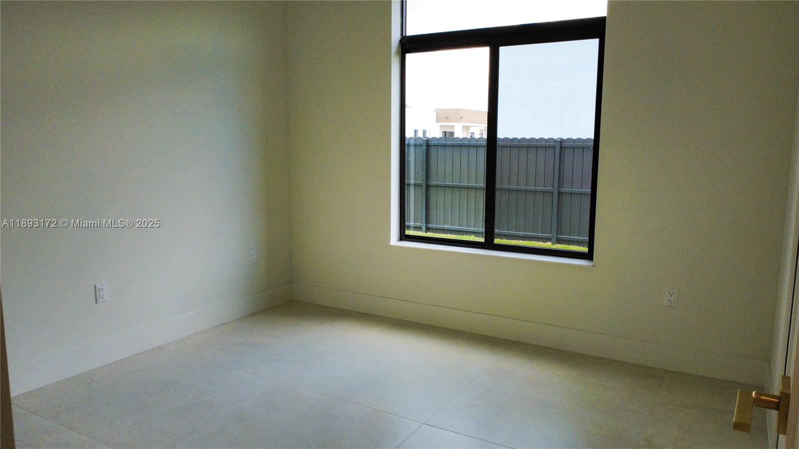 17354 Southwest 287th Street Homestead, FL 33030 - Photo 13 of 22 a view of an empty room with a window