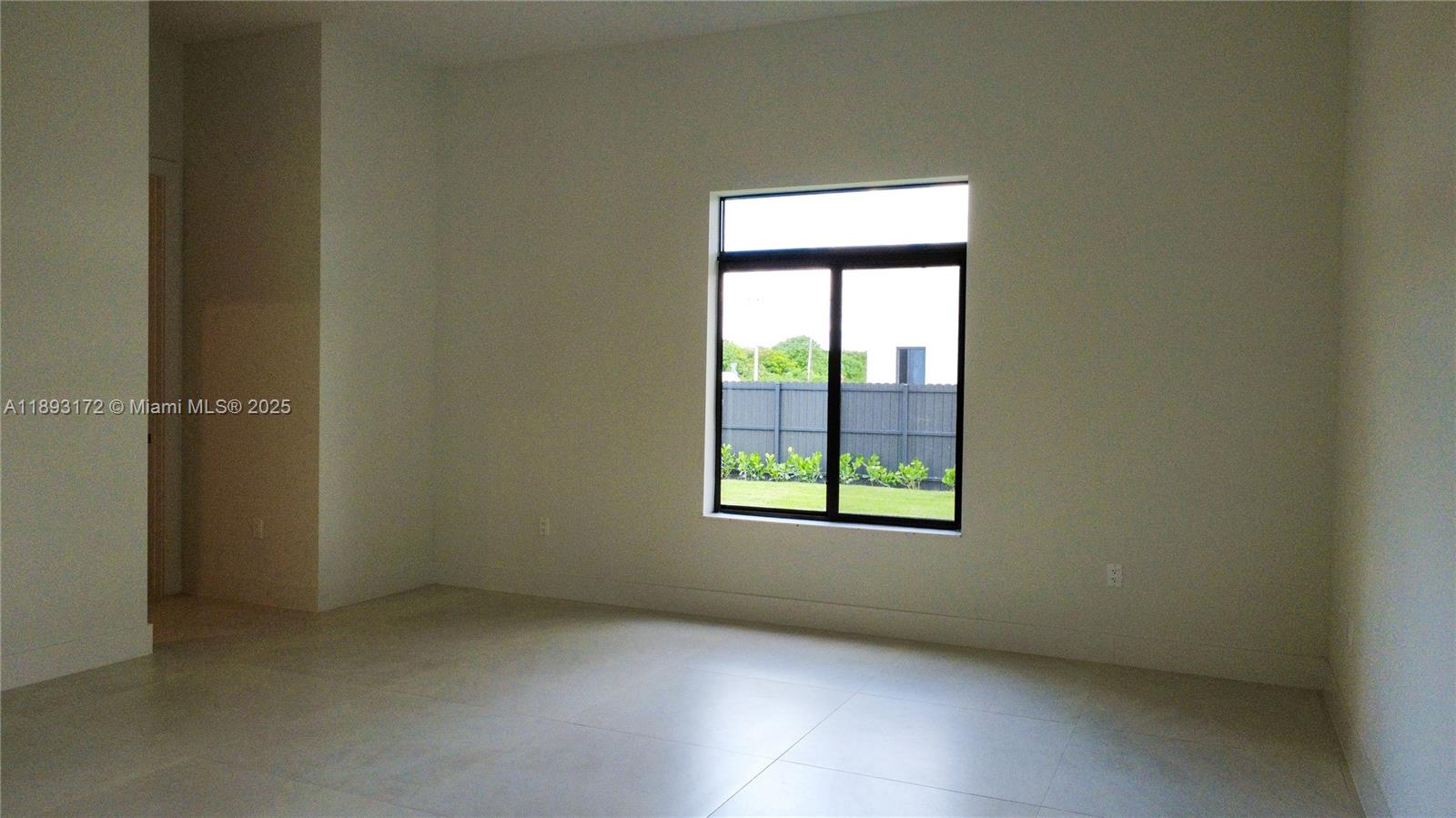 17354 Southwest 287th Street Homestead, FL 33030 - Photo 14 of 22 an empty room with a window