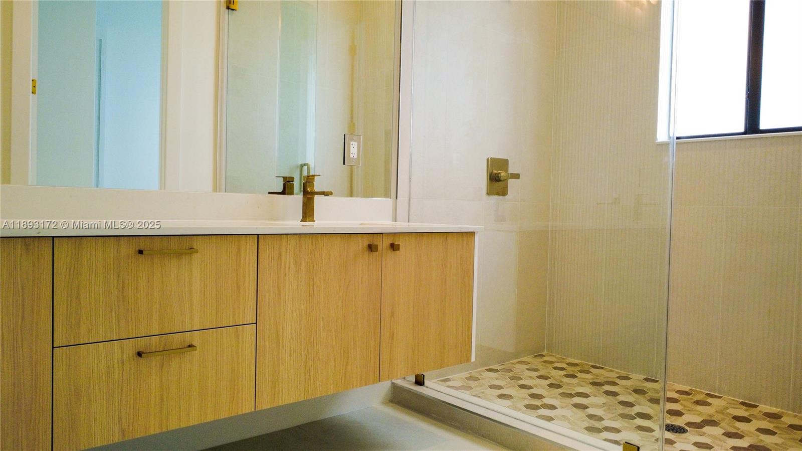 17354 Southwest 287th Street Homestead, FL 33030 - Photo 16 of 22 a bathroom with a sink and a mirror