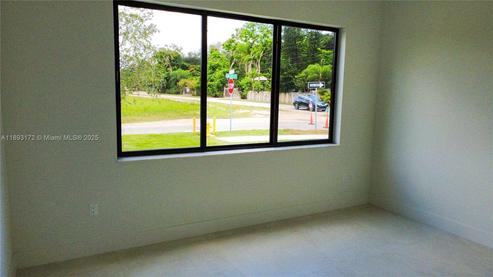 17354 Southwest 287th Street Homestead, FL 33030 - Photo 21 of 22 a view of an empty room with a window