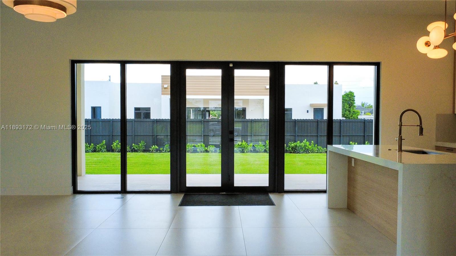17354 Southwest 287th Street Homestead, FL 33030 - Photo 6 of 22 a view of an empty room and window
