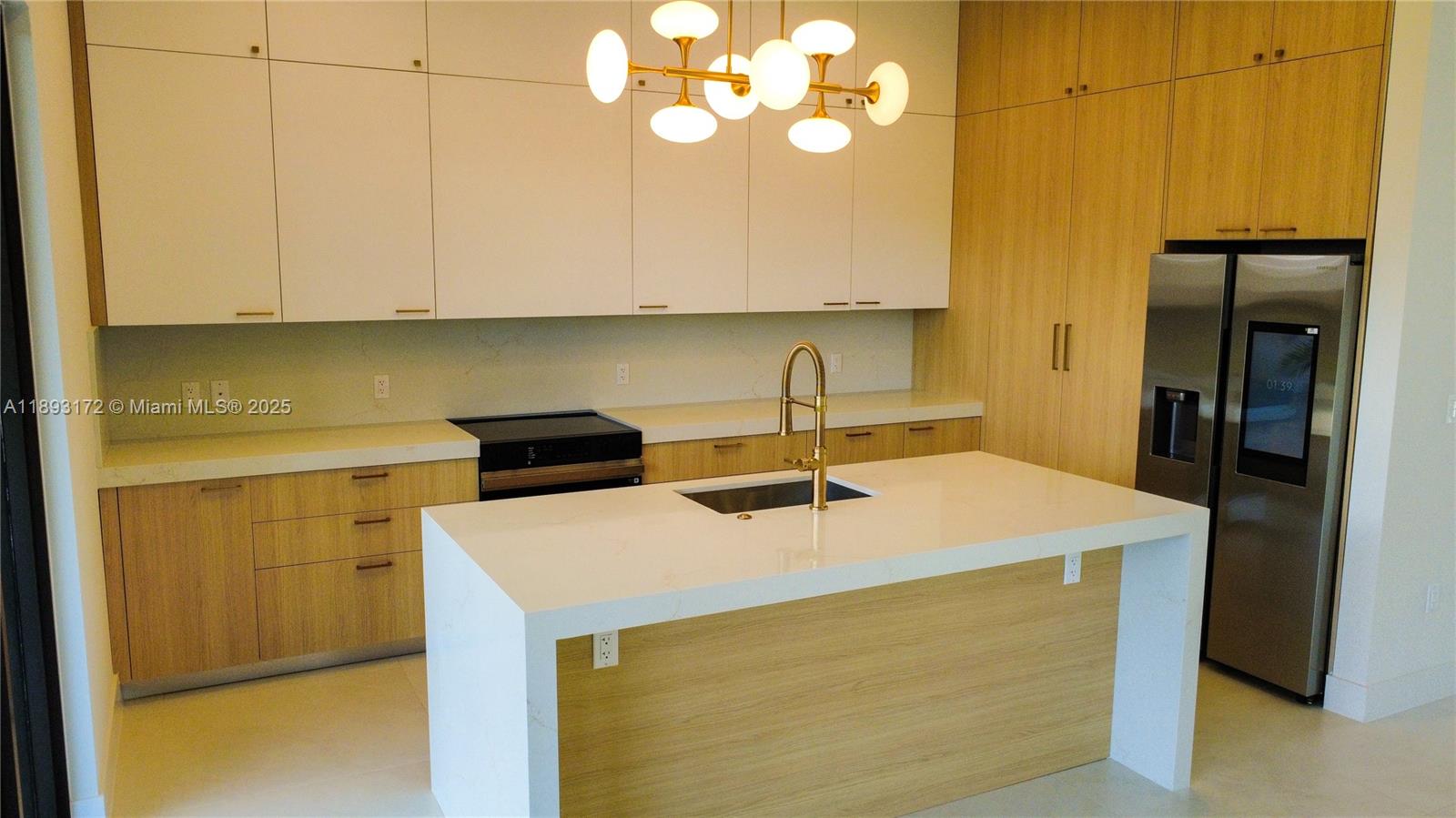 17354 Southwest 287th Street Homestead, FL 33030 - Photo 8 of 22 a kitchen with a sink and a refrigerator