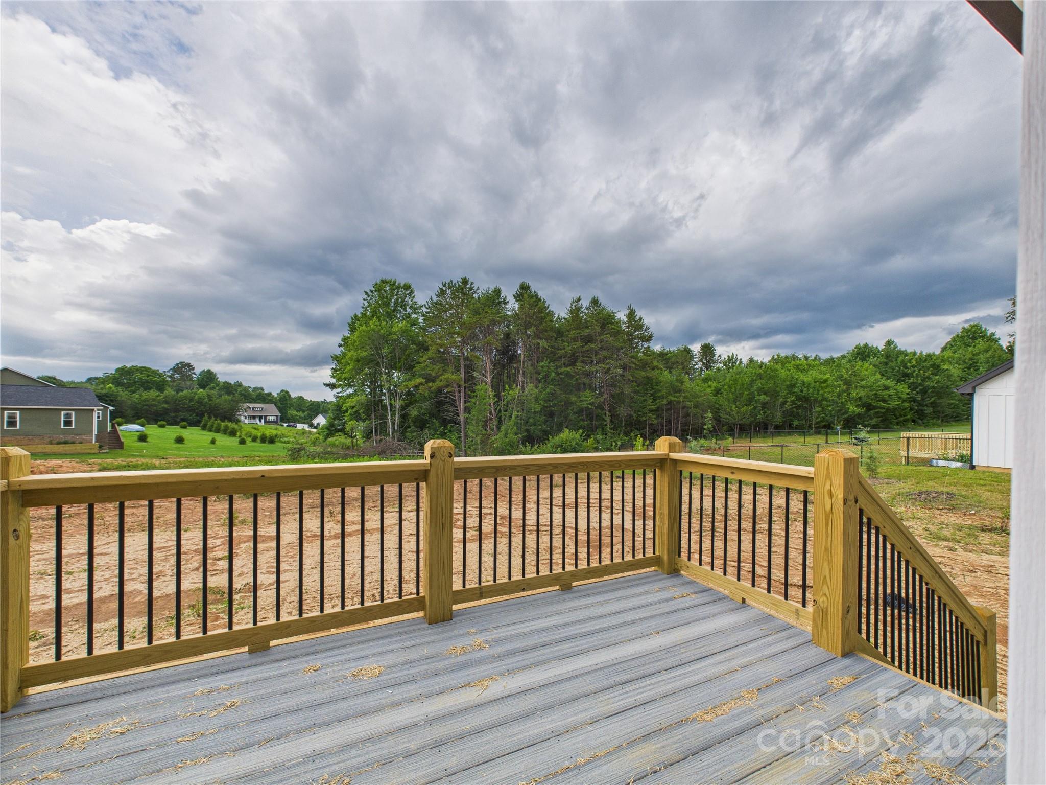 3016 Icard Rhodhiss Road Connelly Springs, NC 28612 - Photo 17 of 20 a terrace view with wooden floor and fence