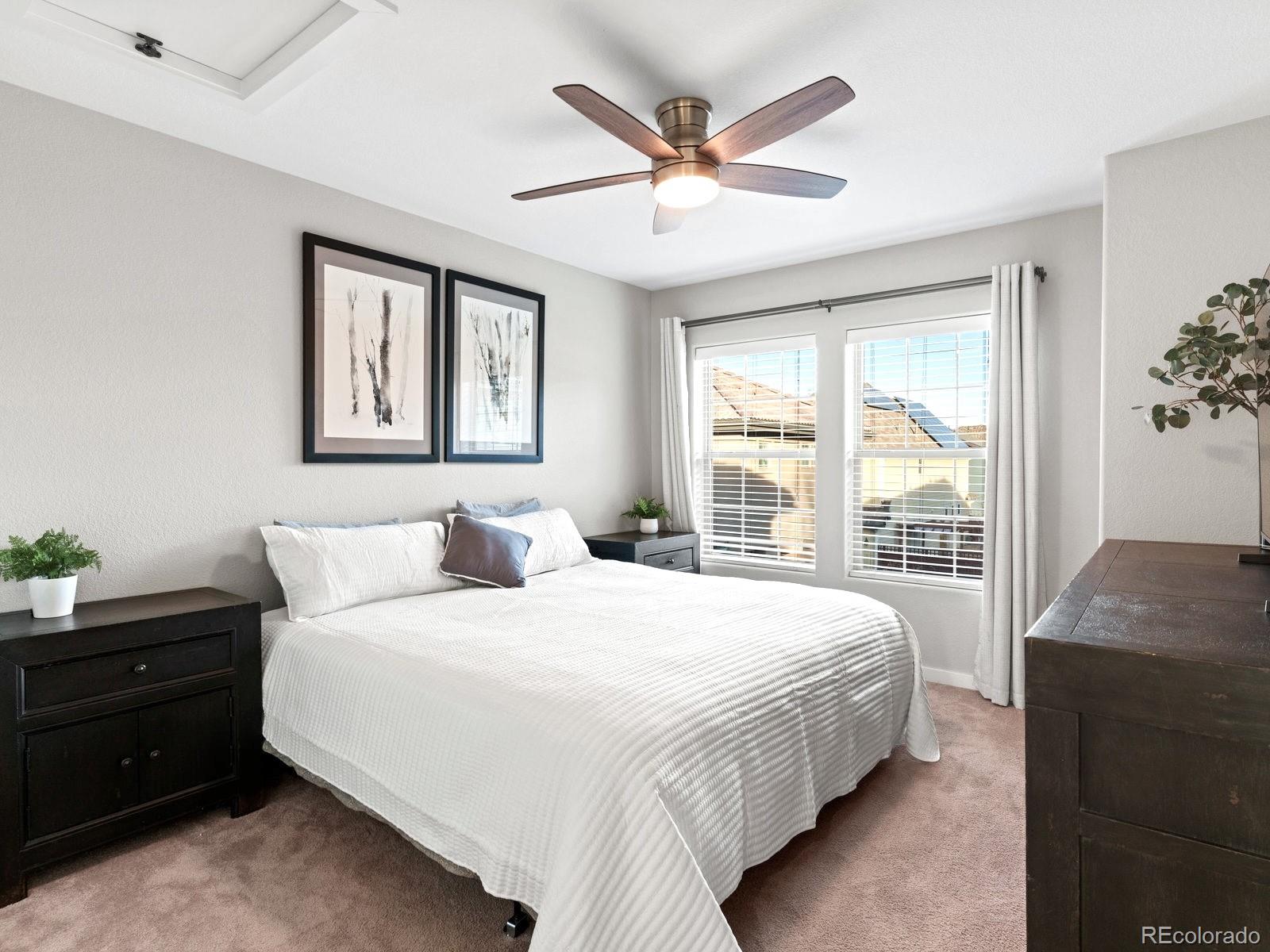 2230 Valentia Street Denver, CO 80238 - Photo 13 of 18 a bedroom with a large bed and a window