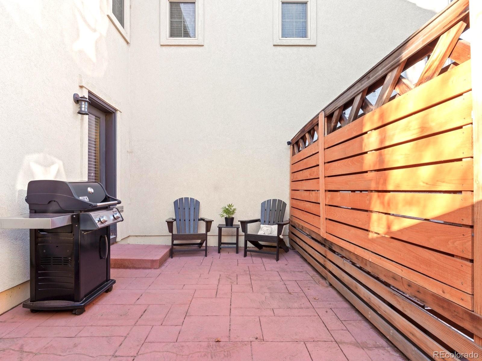 2230 Valentia Street Denver, CO 80238 - Photo 18 of 18 a sitting area with barbeque area in front of it