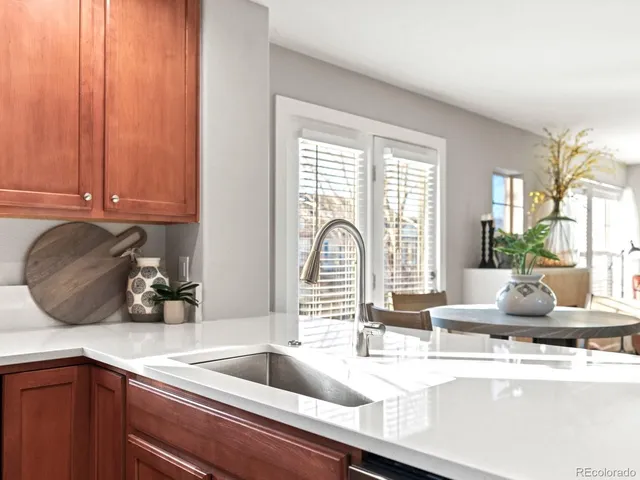 a kitchen with a sink and large window