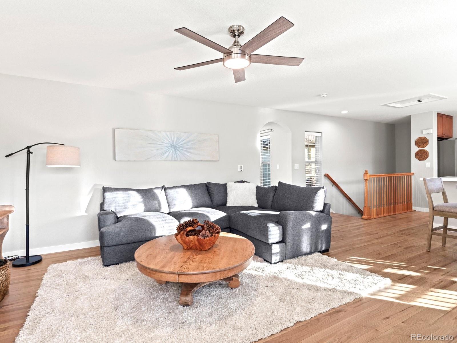 2230 Valentia Street Denver, CO 80238 - Photo 8 of 18 a living room with furniture and a wooden floor