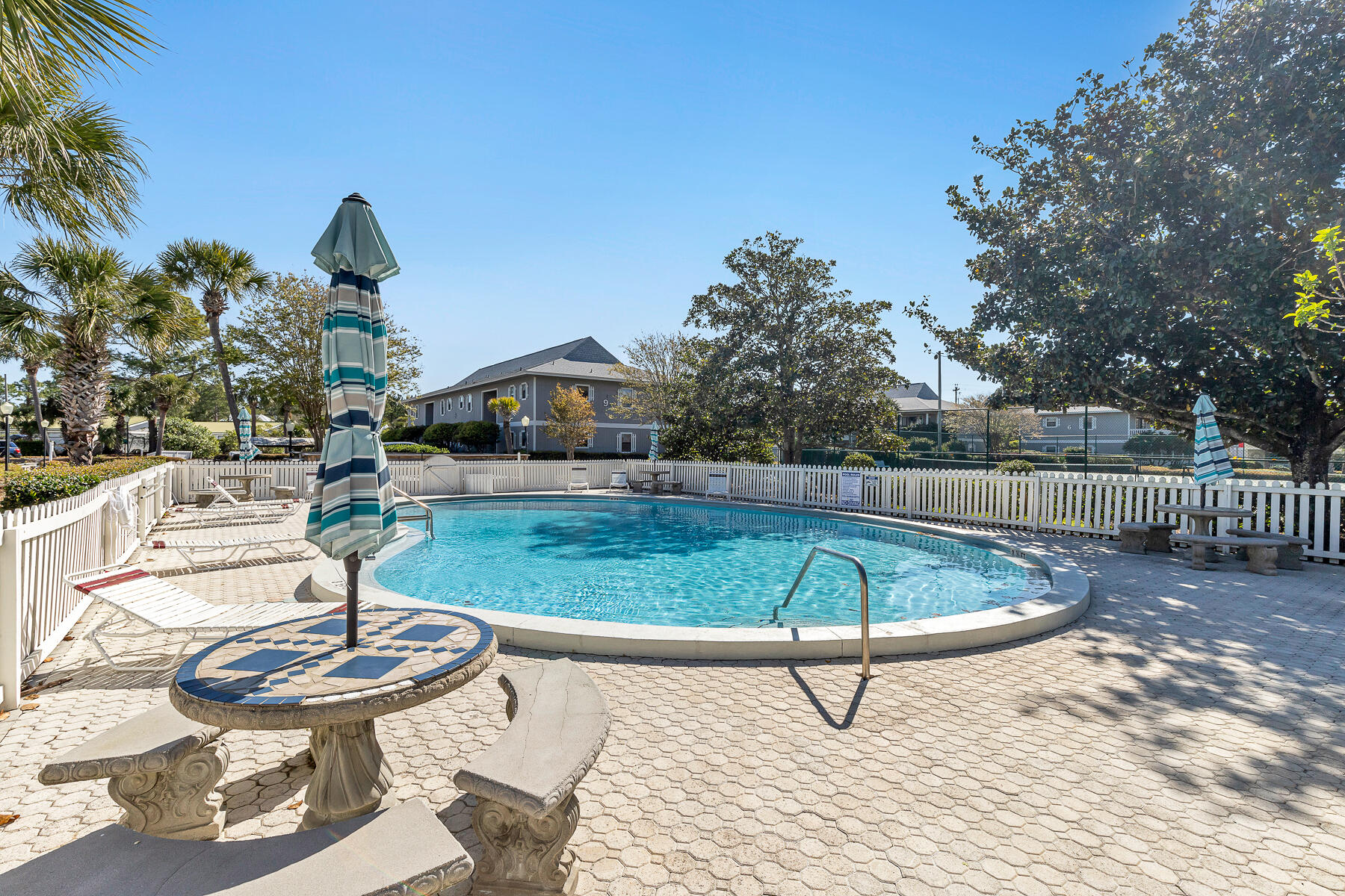 3799 East County Highway 30A, Unit D10 Santa Rosa Beach, FL 32459 - Photo 15 of 42 a view of a swimming pool with a patio and a yard