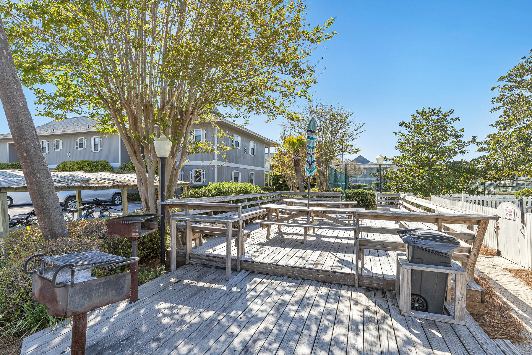 3799 East County Highway 30A, Unit D10 Santa Rosa Beach, FL 32459 - Photo 17 of 42 a view of a patio with table and chairs and potted plants