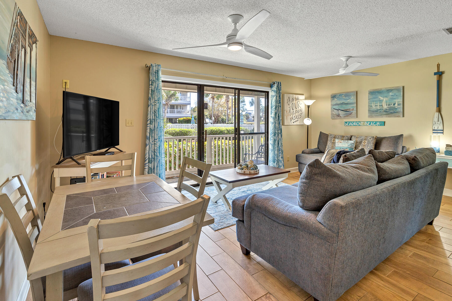 3799 East County Highway 30A, Unit D10 Santa Rosa Beach, FL 32459 - Photo 21 of 42 a living room with furniture and a flat screen tv