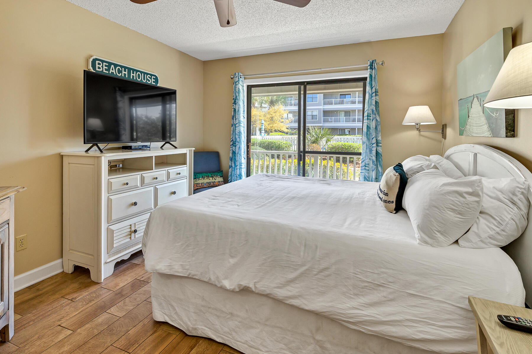 3799 East County Highway 30A, Unit D10 Santa Rosa Beach, FL 32459 - Photo 30 of 42 a bedroom with a bed and a flat screen tv