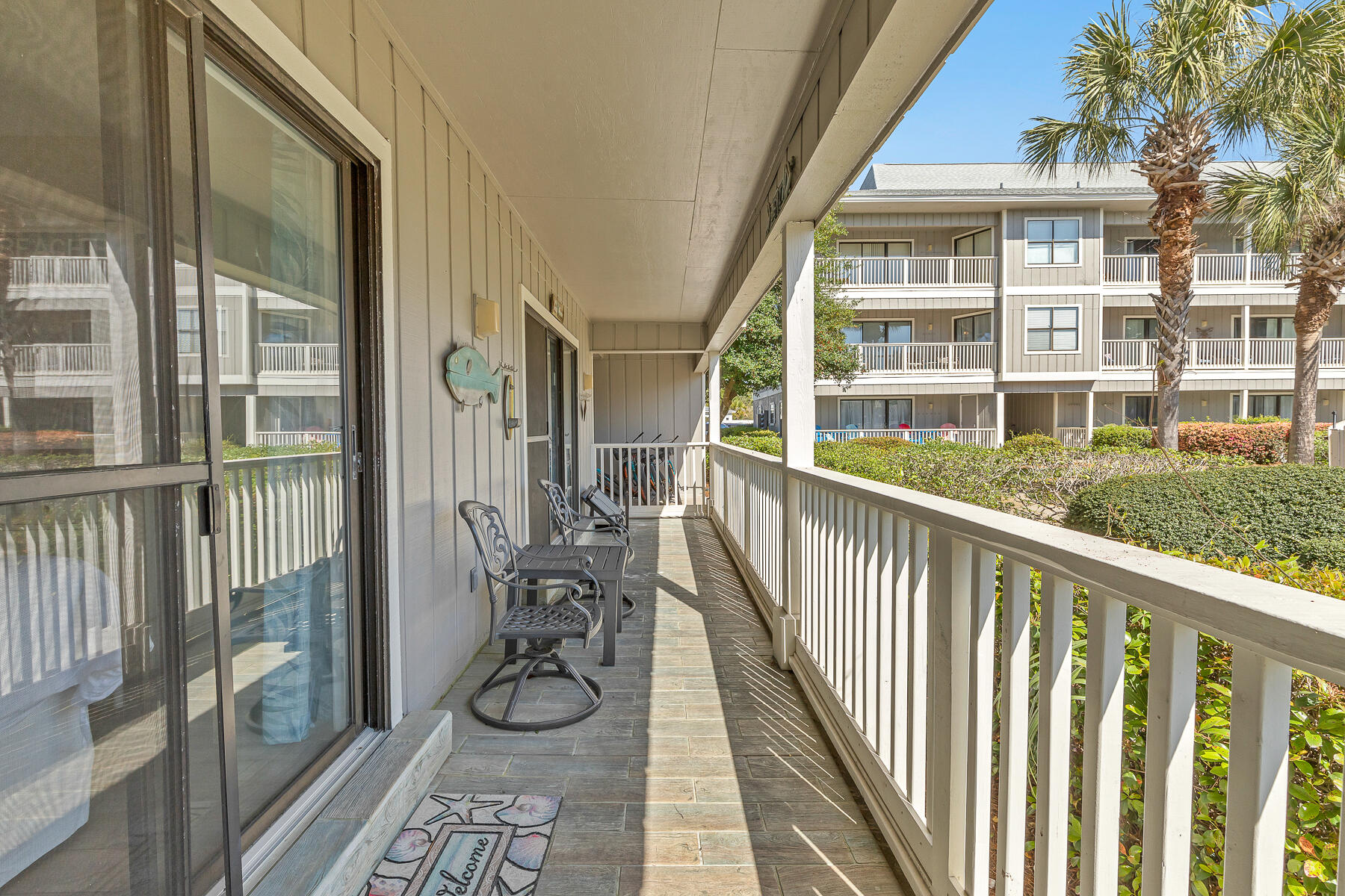 3799 East County Highway 30A, Unit D10 Santa Rosa Beach, FL 32459 - Photo 34 of 42 a view of balcony with wooden floor and fence