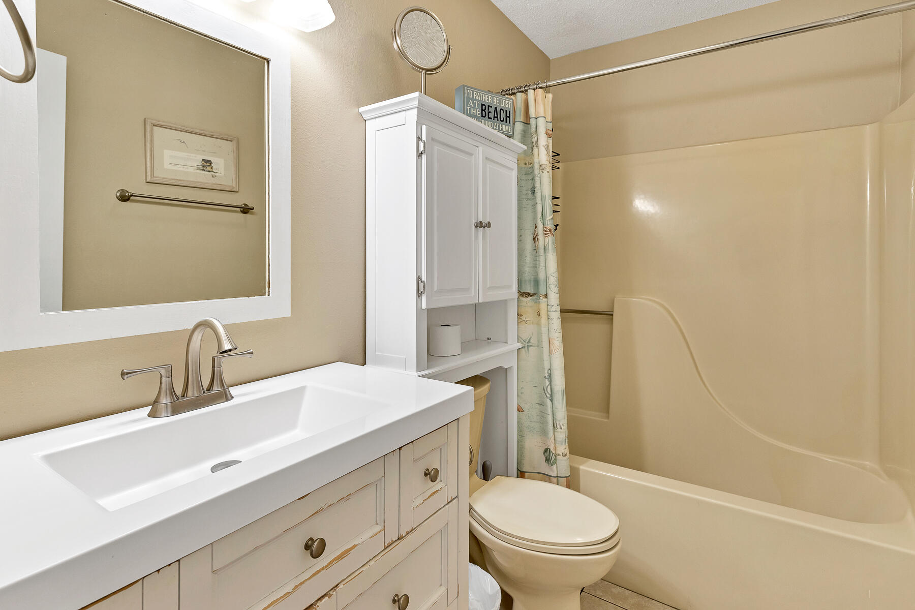 3799 East County Highway 30A, Unit D10 Santa Rosa Beach, FL 32459 - Photo 35 of 42 a bathroom with a sink a toilet and shower