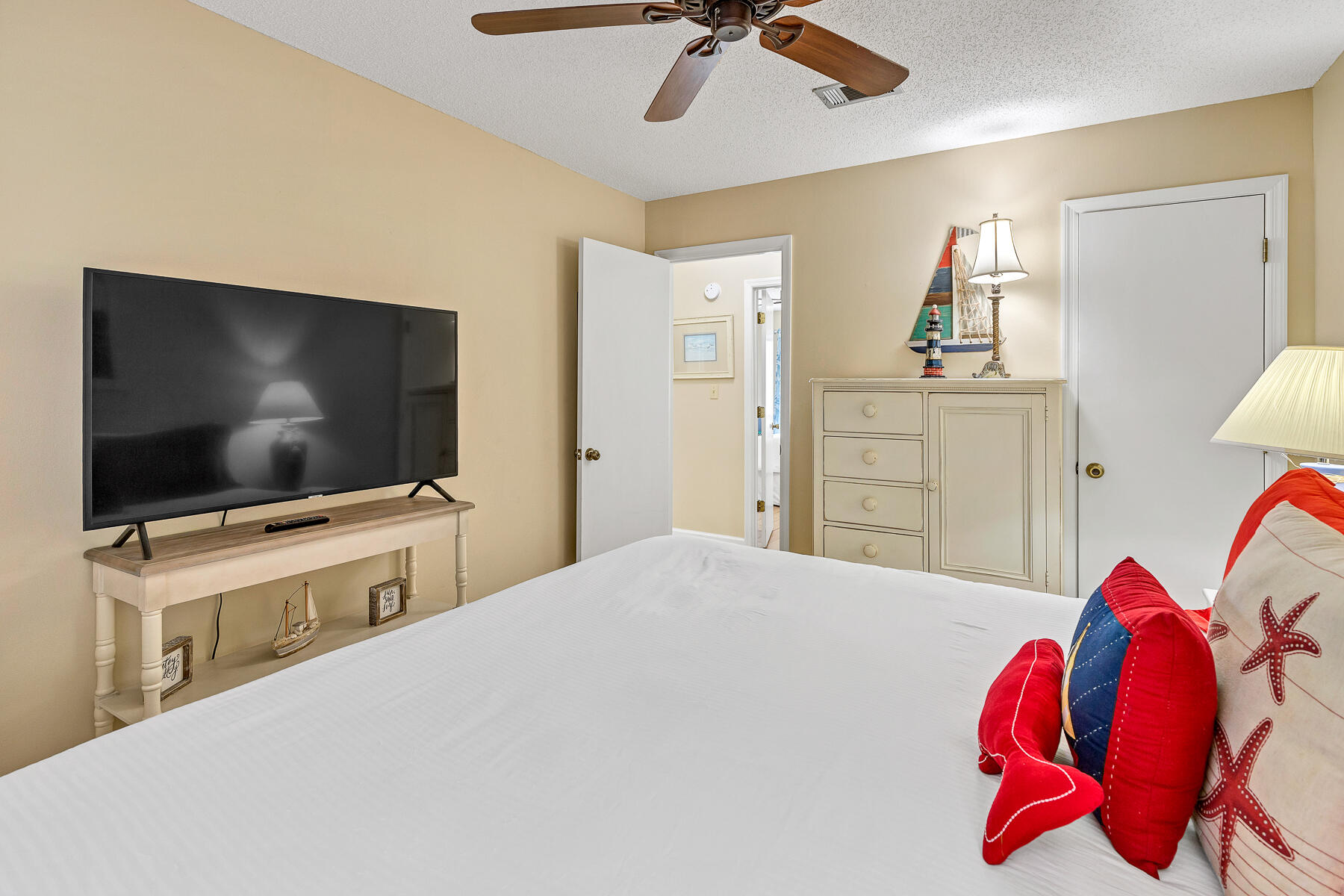 3799 East County Highway 30A, Unit D10 Santa Rosa Beach, FL 32459 - Photo 37 of 42 a bedroom with a bed and a flat screen tv