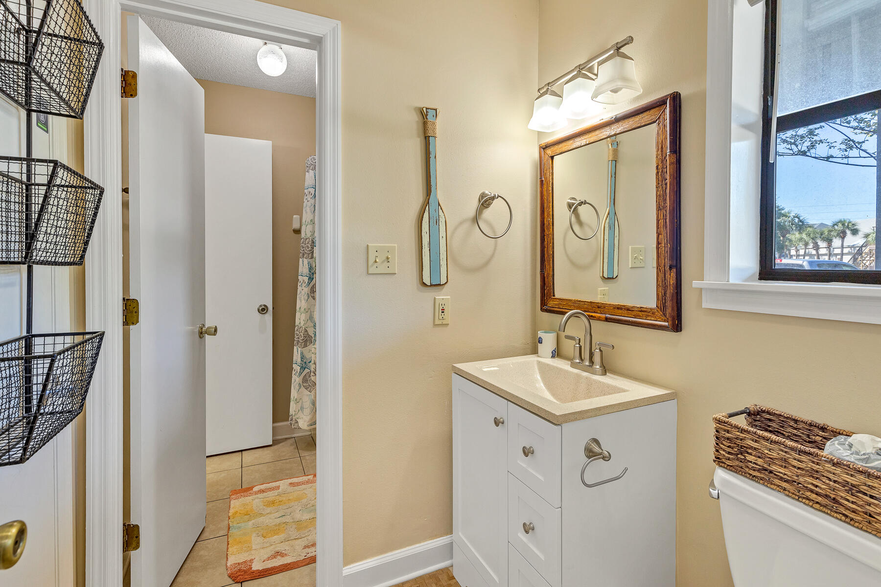 3799 East County Highway 30A, Unit D10 Santa Rosa Beach, FL 32459 - Photo 40 of 42 a bathroom with a sink a mirror a vanity and a shower