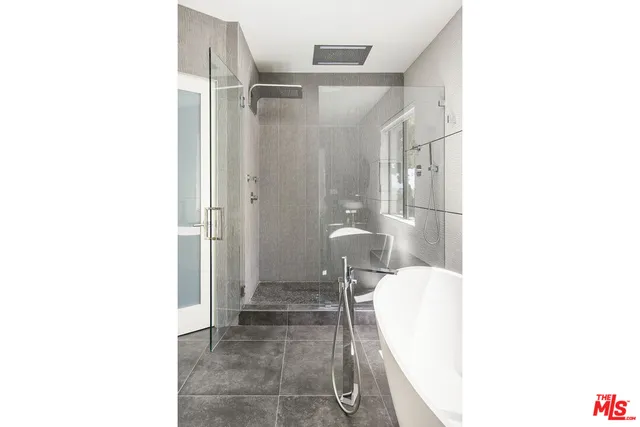 a bathroom with a sink and a shower