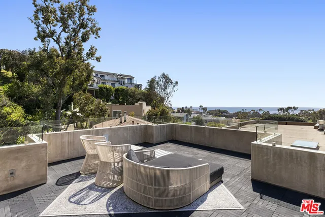 an outdoor sitting area with a couch
