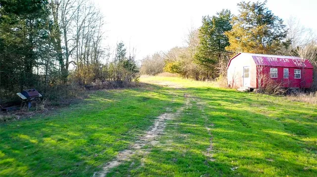 a bathroom with a toilet sink and shower