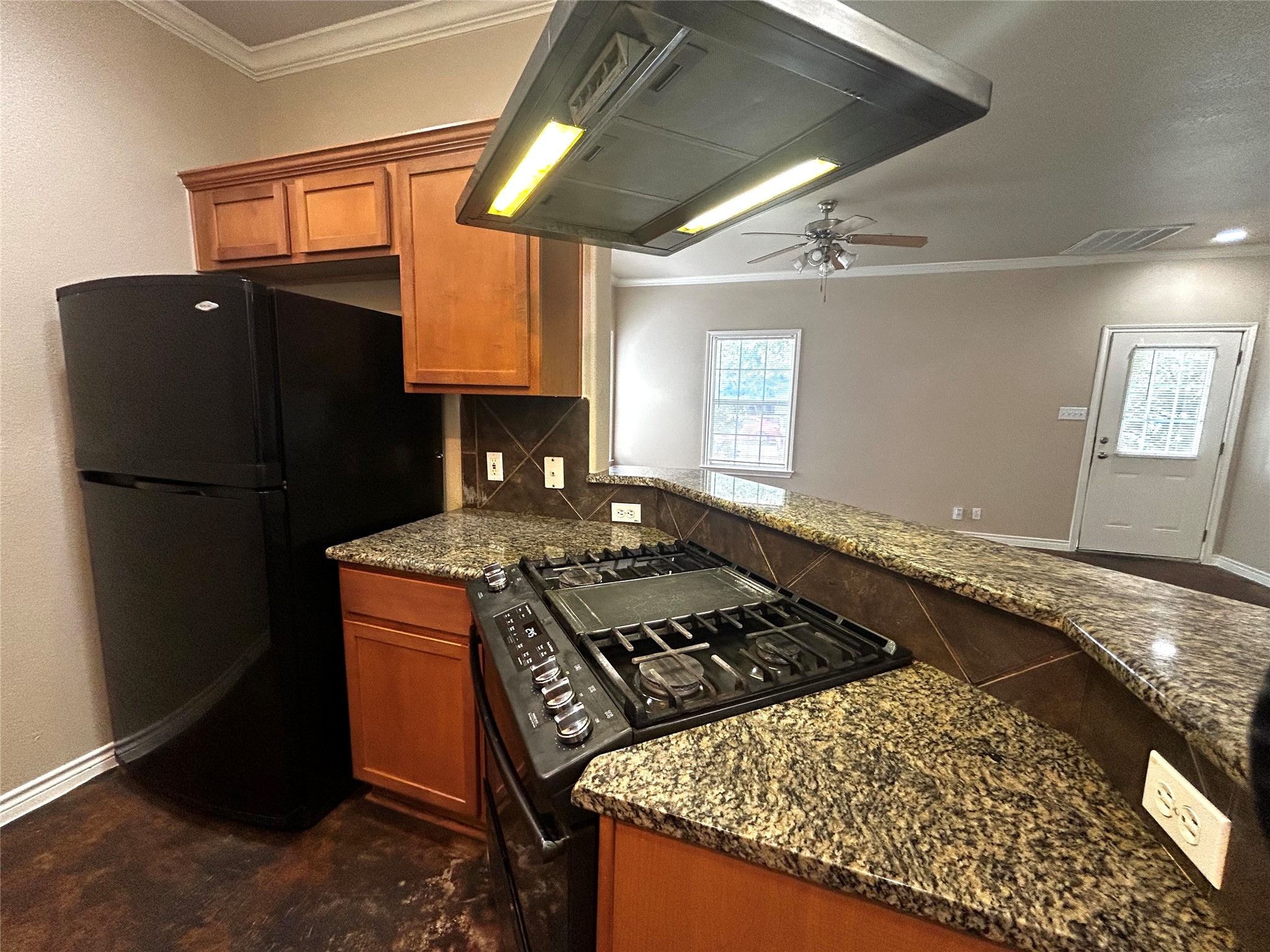 408 Nelray Boulevard, Unit A Austin, TX 78751 - Photo 11 of 36 a kitchen with a stove and a refrigerator