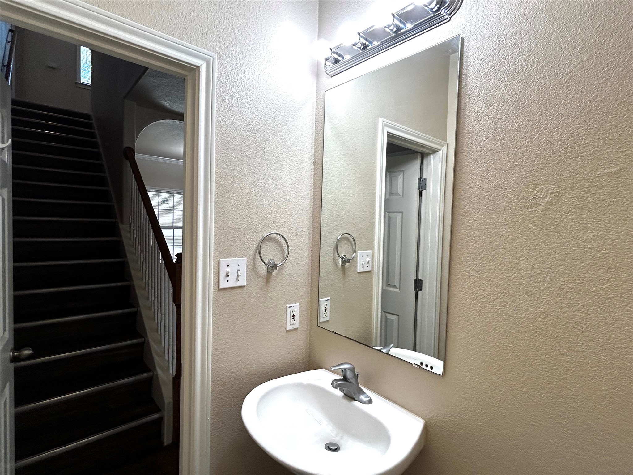 408 Nelray Boulevard, Unit A Austin, TX 78751 - Photo 14 of 36 a bathroom with a sink a mirror and shower