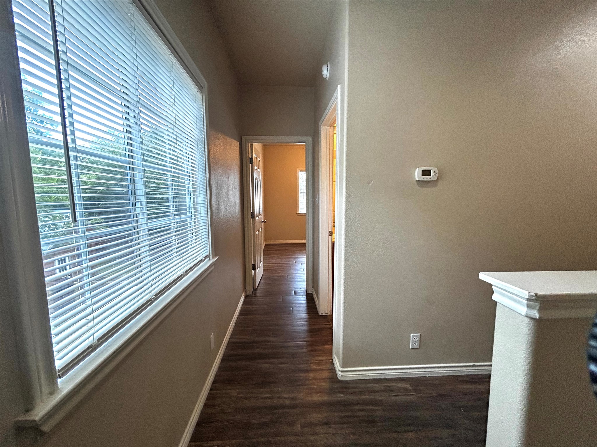 408 Nelray Boulevard, Unit A Austin, TX 78751 - Photo 16 of 36 a view of a hallway with wooden floor and a window