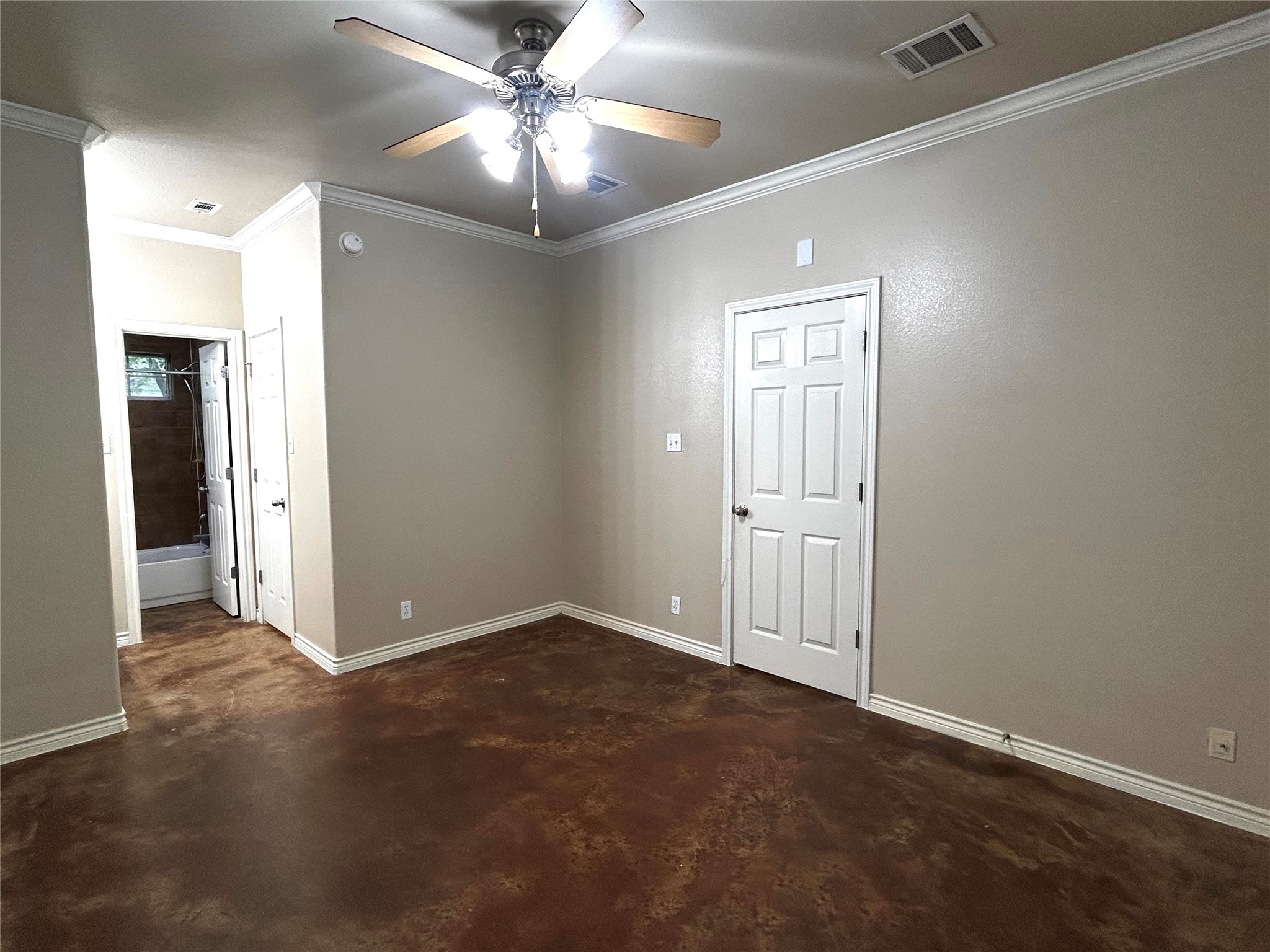 408 Nelray Boulevard, Unit A Austin, TX 78751 - Photo 18 of 36 an empty room with fan and entrance