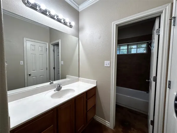 a bathroom with a toilet and shower