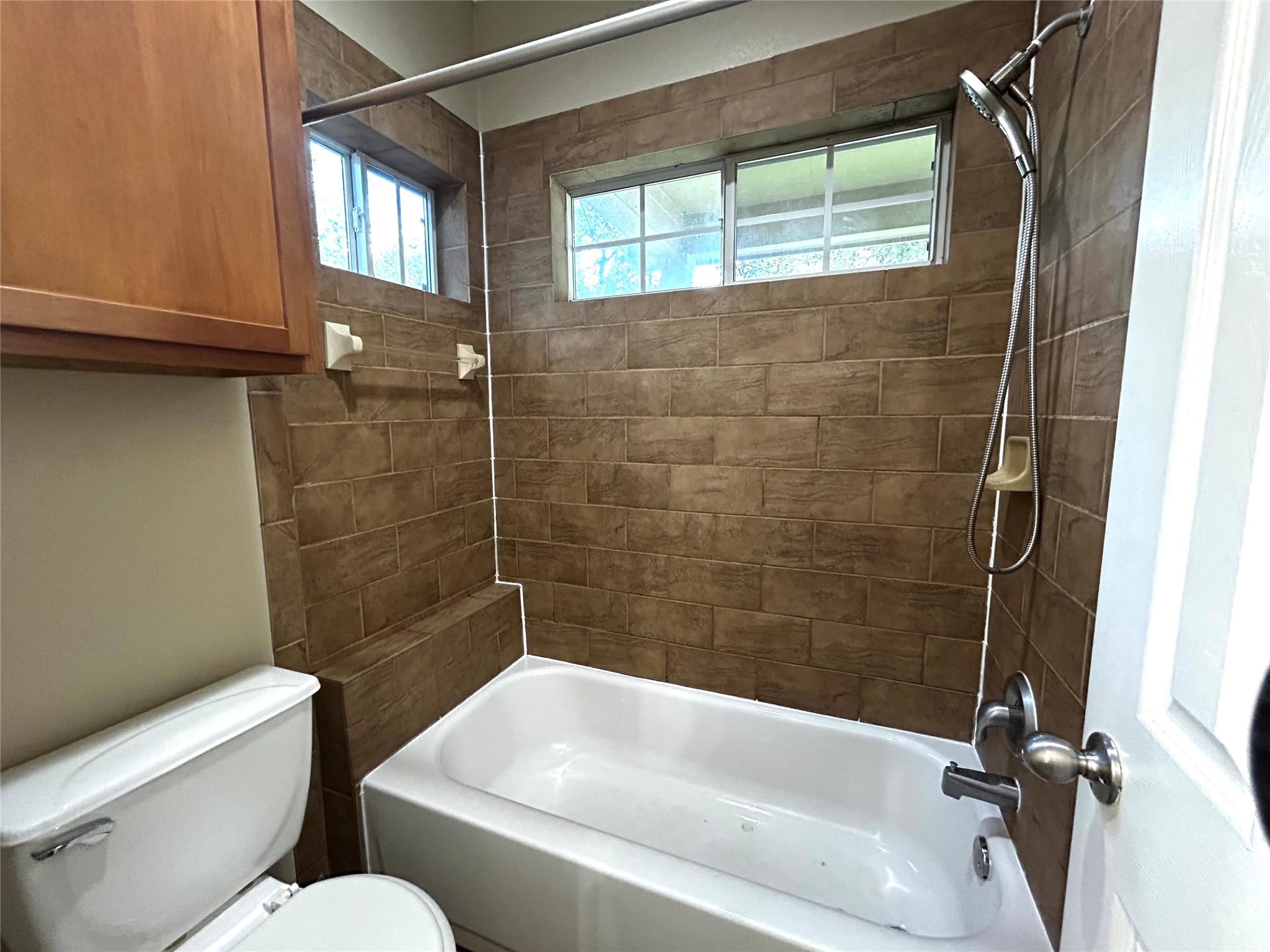 408 Nelray Boulevard, Unit A Austin, TX 78751 - Photo 20 of 36 a bathroom with a toilet and shower