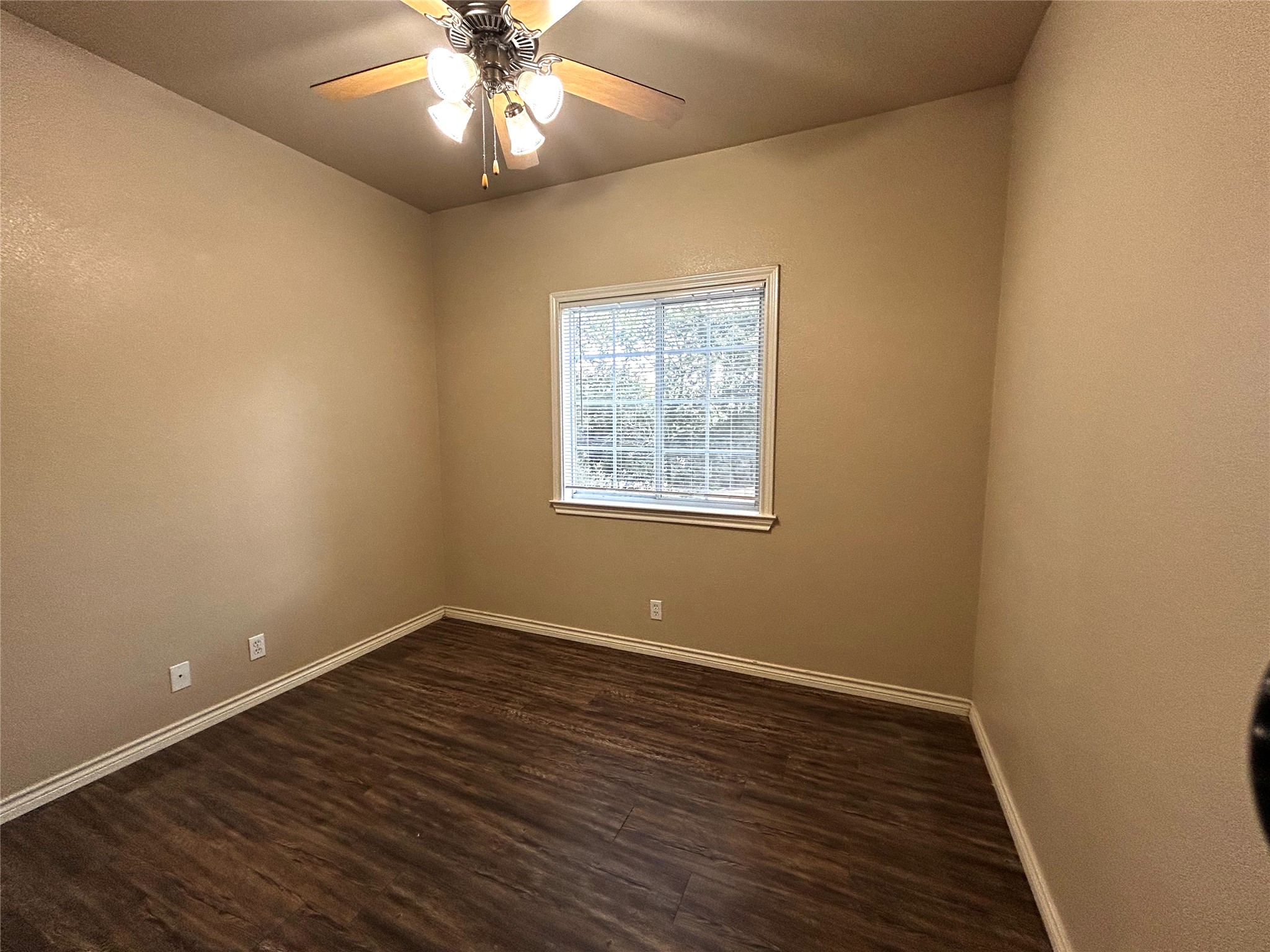 408 Nelray Boulevard, Unit A Austin, TX 78751 - Photo 22 of 36 a view of an empty room with wooden floor and a window