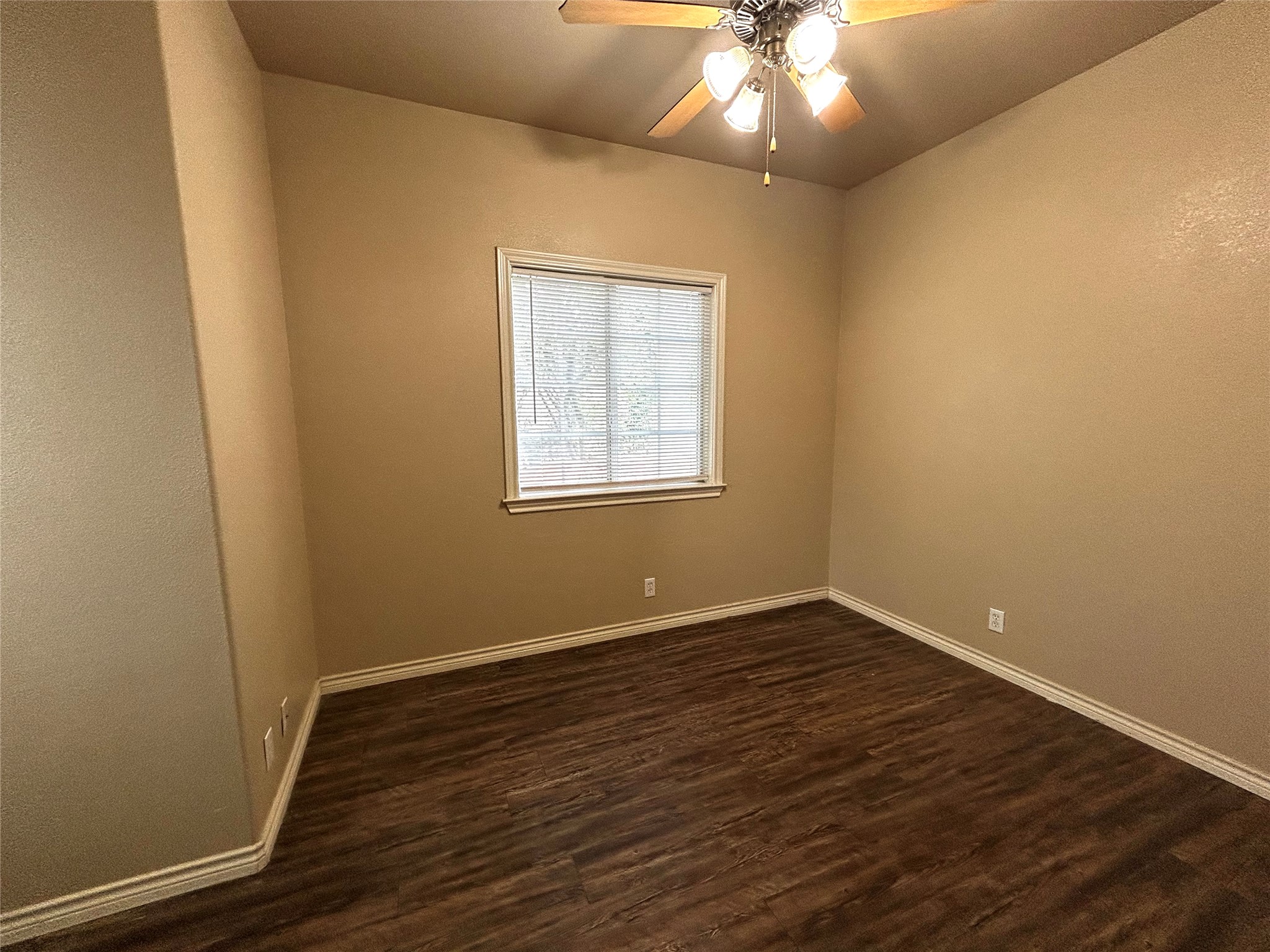408 Nelray Boulevard, Unit A Austin, TX 78751 - Photo 28 of 36 an empty room with wooden floor and windows